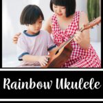 A picture of a teacher handing a student a ukulele. The words on the image read "Rainbow Ukulele: Digital Student Method Book"